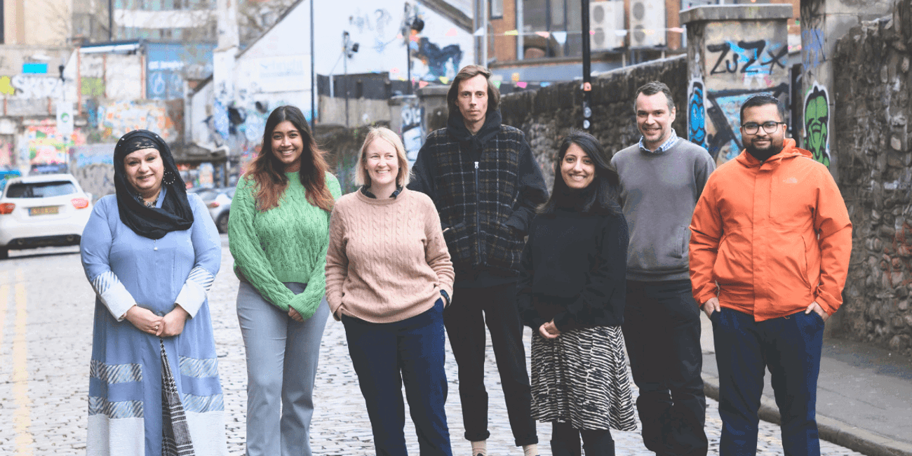 Members of GWCU Staff Team standing in an outdoor location
