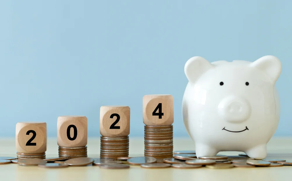 stacks of coins with blocks of 2024 with piggy bank stacks of coins with blocks of 2024 with piggy bank