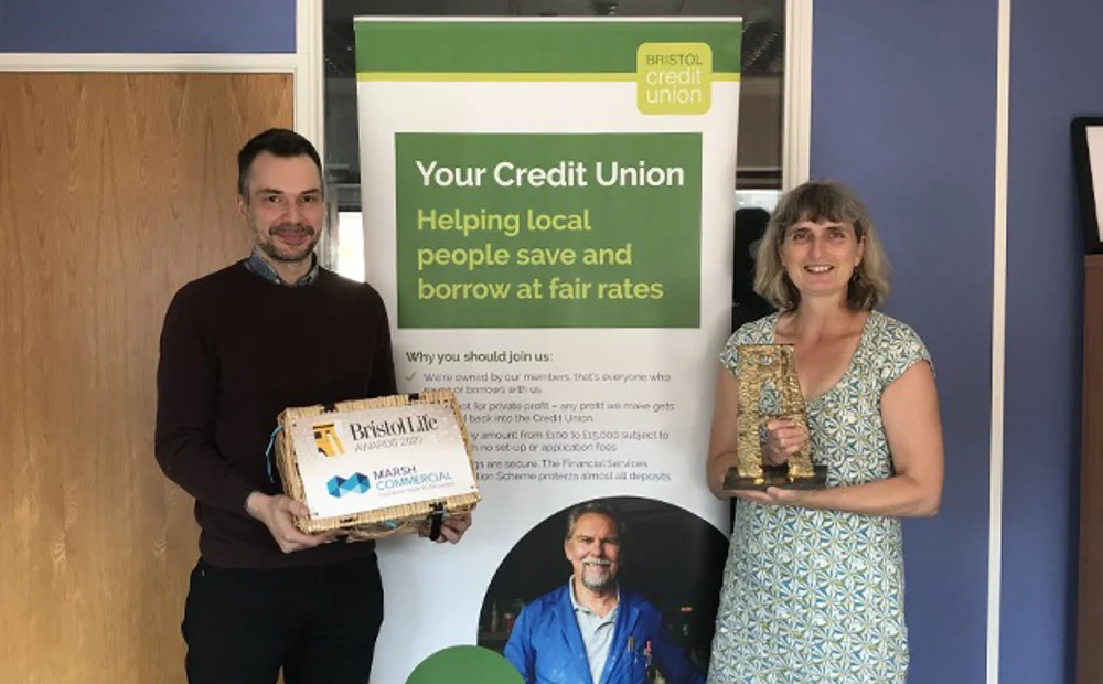 Two employees holding the Bristol Life Award Two employees holding the Bristol Life Award