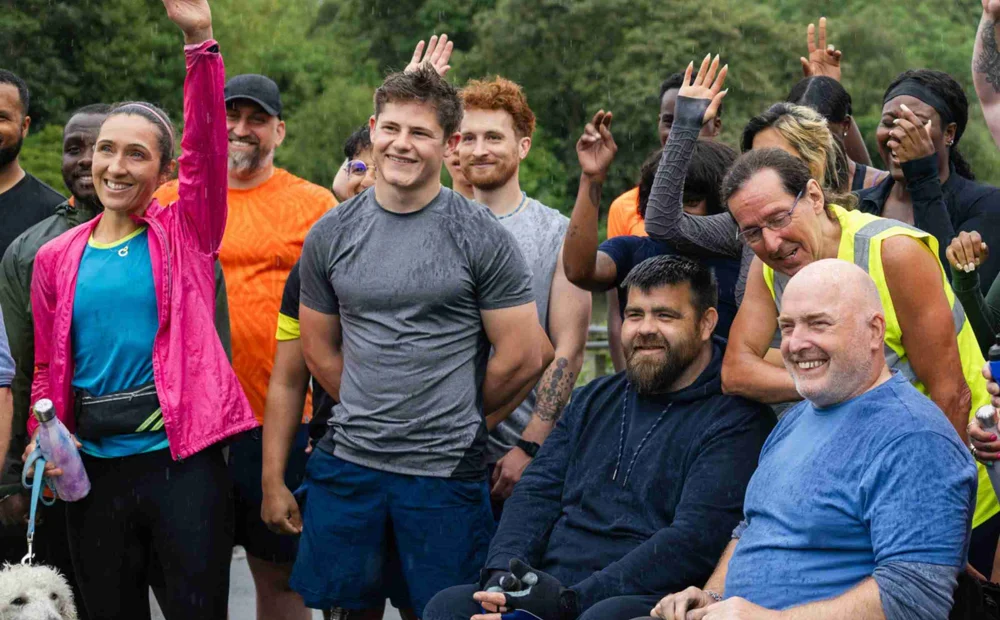 People In Exercise Clothes Raising Their Hands Getting Ready For A Race People In Exercise Clothes Raising Their Hands Getting Ready For A Race
