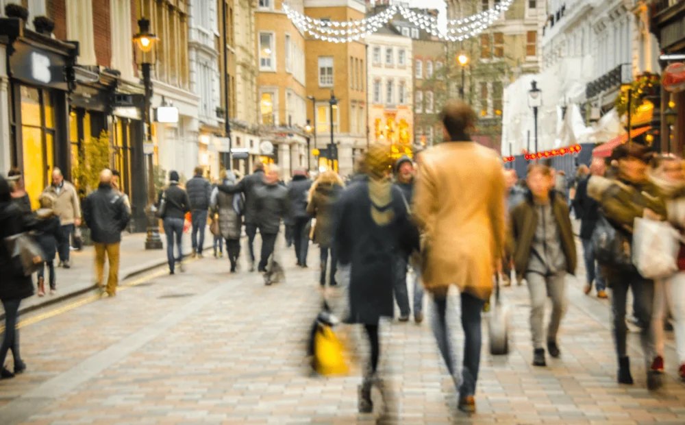 people walking through a high street people walking through a high street