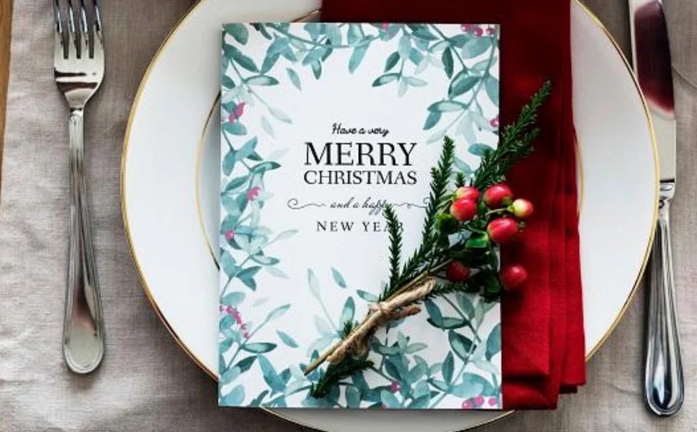 place setting at christmas with plates, cutlery and decoration place setting at christmas with plates, cutlery and decoration