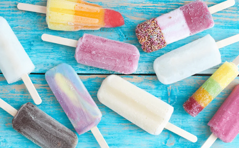 ice lollies on a blue table ice lollies on a blue table