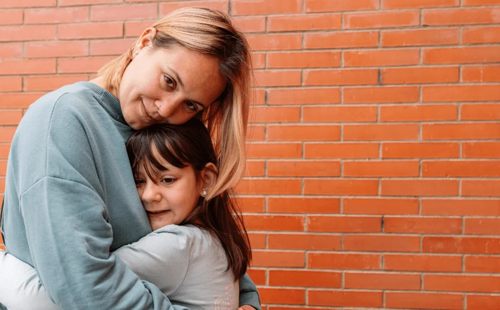 mother and daughter hugging mother and daughter hugging