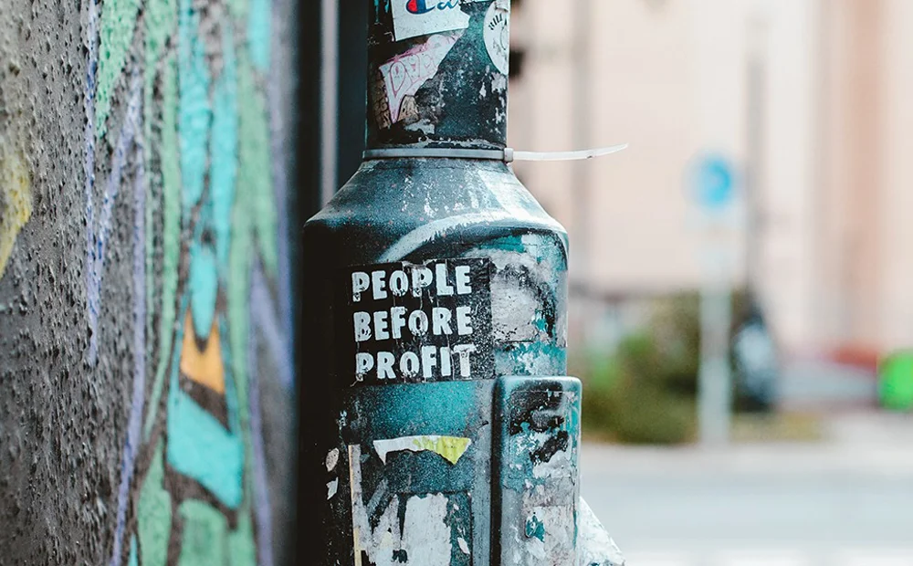 lamp post with people before profit lamp post with people before profit