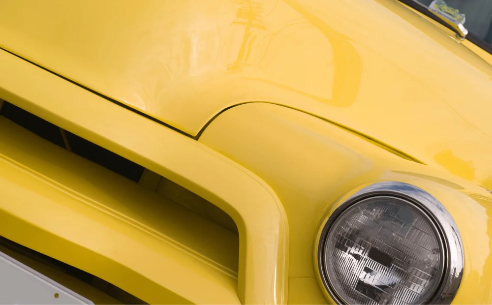 close up of yellow car close up of yellow car