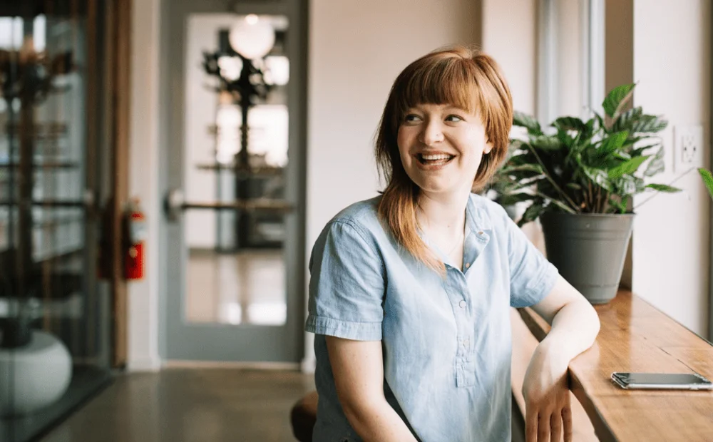 woman sitting at bar smiling woman sitting at bar smiling